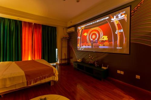 Postel nebo postele na pokoji v ubytování Dalian Hong Xi Yuan Apartment Wanda Plaza