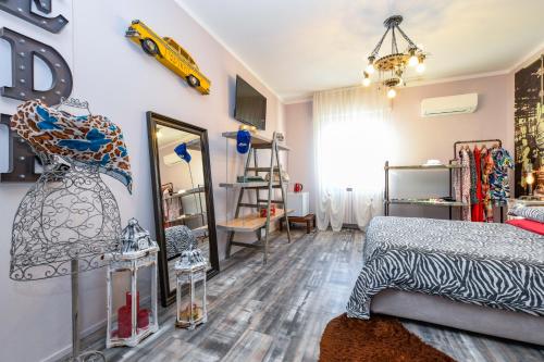 a room with a bed and a dress on the wall at Villa Giulia Rooms & Bike in Toscolano Maderno