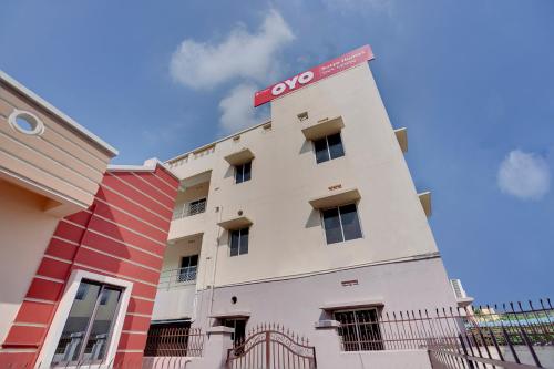 a building with aovo sign on top of it at OYO Satya Homes in Khandagiri