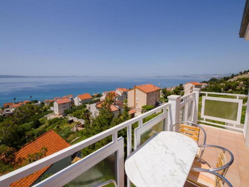 a balcony with a view of the ocean at Apartments Bandalo in Podstrana