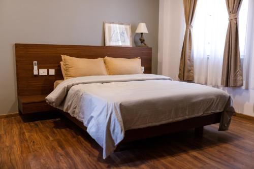Postel nebo postele na pokoji v ubytování Kibu Apartments