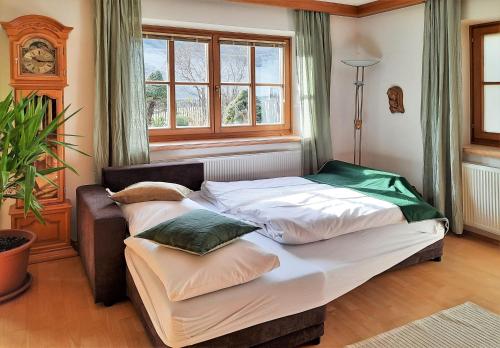 two beds in a room with a window at 103 m2 Apartment EschenWald vomLandl Leogang in Leogang