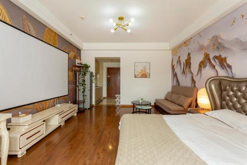 Postel nebo postele na pokoji v ubytování Dalian Hong Xi Yuan Apartment Wanda Plaza