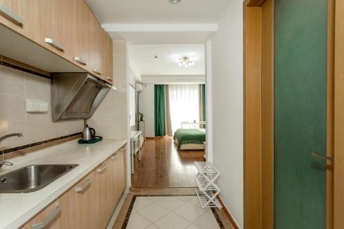 Kuchyň nebo kuchyňský kout v ubytování Dalian Hong Xi Yuan Apartment Wanda Plaza