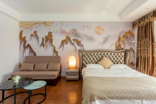 Postel nebo postele na pokoji v ubytování Dalian Hong Xi Yuan Apartment Wanda Plaza