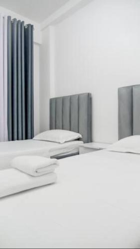 Centaurus Apartments 객실 침대