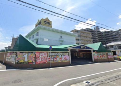a store on the corner of a city street at Hotel Esta in Miyazaki