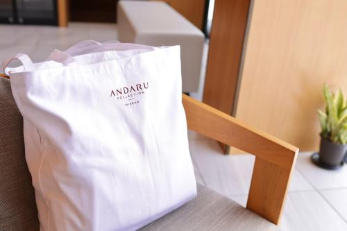 a white bag sitting on top of a table at Andaru Collection Niseko in Kutchan