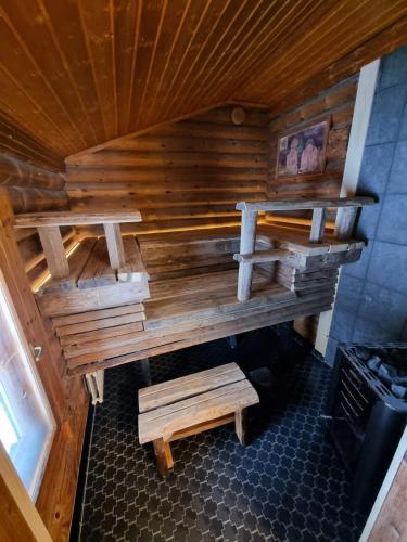 an overhead view of a wooden sauna with benches at Vänvik Pyhtää in Siltakylä