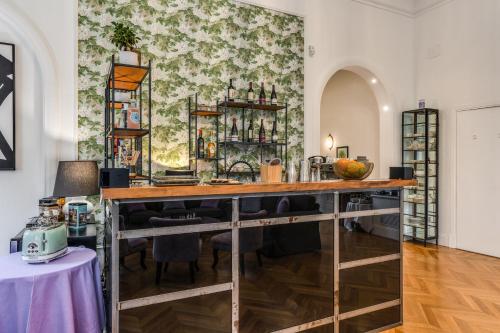 a bar in the middle of a room at Mangili Garden Hotel in Rome