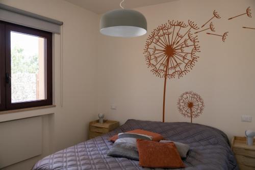 Una cama o camas en una habitación de Agriturismo Colpo di Fortuna