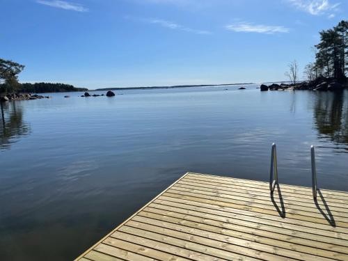 a dock on a body of water at Vänvik Pyhtää in Siltakylä