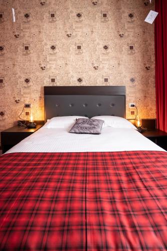 Letto o letti in una camera di Binario Magic RistoHotel