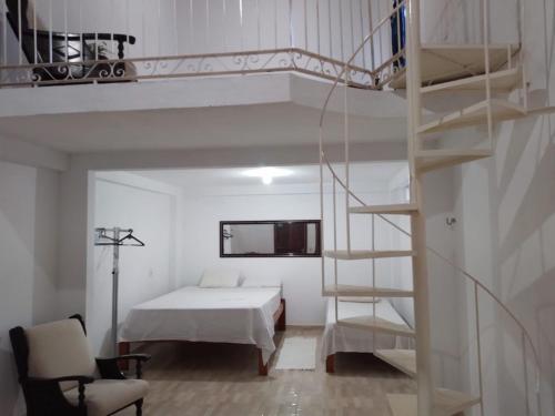 a bedroom with a bunk bed and a ladder at Centric Alter a 600m da praia in Alter do Chao