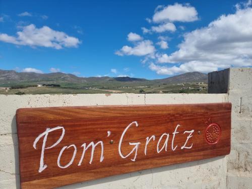 a sign on a wall that reads funfair at Pom Gratz - EcoDomes in Hartebeest Rivier