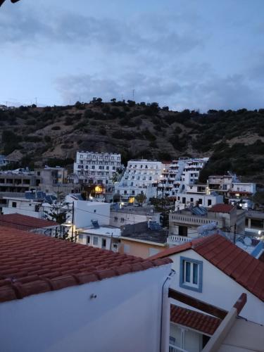 a view of a city from the roofs of buildings at Kissandros Hotel in Agia Galini