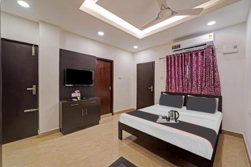 Ένα ή περισσότερα κρεβάτια σε δωμάτιο στο Hotel O J2 Service Apartment