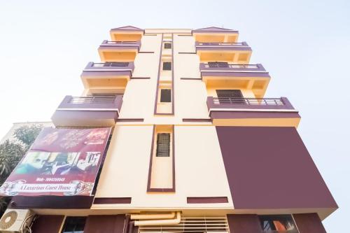 a building with balconies on the side of it at Flagship Flagship Hotel Dream Inn in Dānāpur