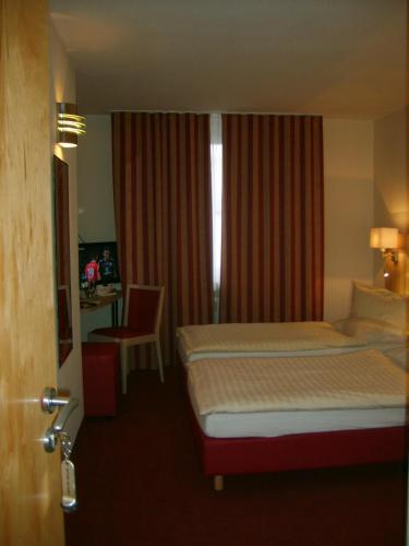 Postel nebo postele na pokoji v ubytování City Hotel by celina