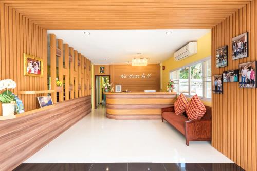 a lobby of a salon with wood paneling at AU Place Hotel in Loei