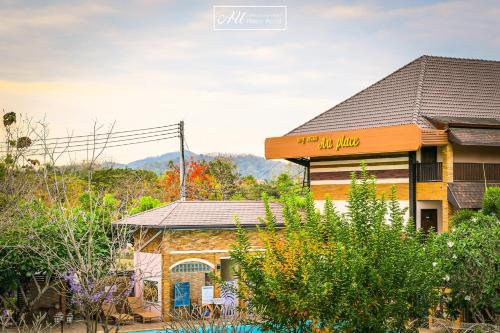 a house with a sign that reads the joy house at AU Place Hotel in Loei