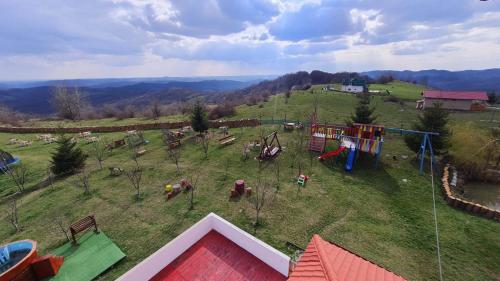 an aerial view of a playground on a hill at Pensiune Runcu Stone in Runcu