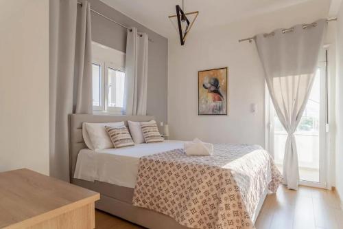 Ένα ή περισσότερα κρεβάτια σε δωμάτιο στο Stelianas House Top Floor Apartment with Private Jacuzzi