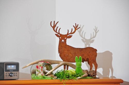 a figurine of a deer on top of a table at Ferienwohnungen Wendelstein in Bad Feilnbach