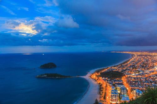 an aerial view of a city at night at Seascape Villa B&B in Tauranga