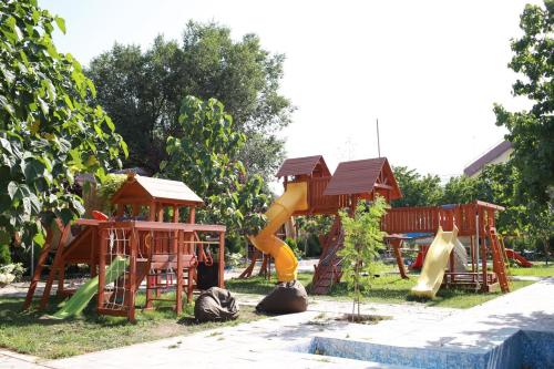 a park with a playground with a slide at Cross Resort Hotel in Yerevan