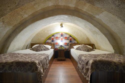 Mira Cappadocia Hotelにあるベッド