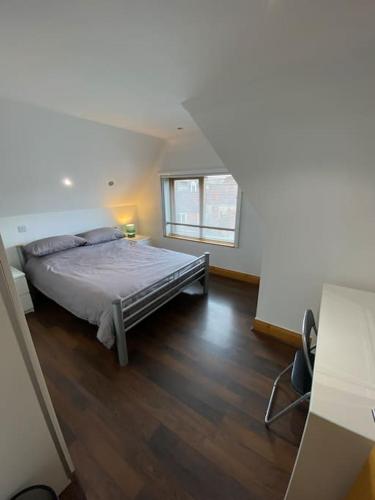 a bedroom with a bed and a window at spacious 2 bed apartment in Norwich city centre in Norwich