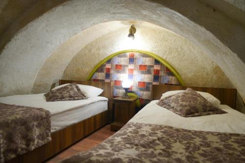 Mira Cappadocia Hotelにあるベッド