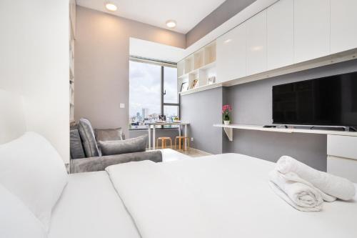 Ένα ή περισσότερα κρεβάτια σε δωμάτιο στο Saigon Home Apartment - Infinity Pool