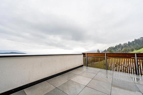 a balcony with a view of the ocean at Maurerhof Abendrot in Maranza