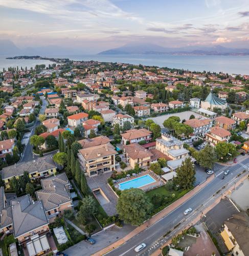 an aerial view of a city with a road and houses at Hotel Gardenia Sirmione in Sirmione