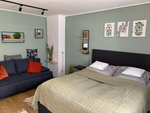 Postel nebo postele na pokoji v ubytování Újhely vára Apartman