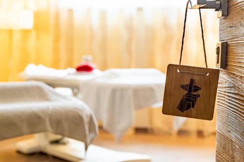 a hospital room with a bed with a sign at Der Schütthof in Zell am See