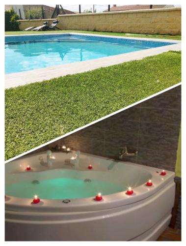 a bath tub with lights in front of a swimming pool at LOS SUEÑOS DE JAVIER in Robledillo