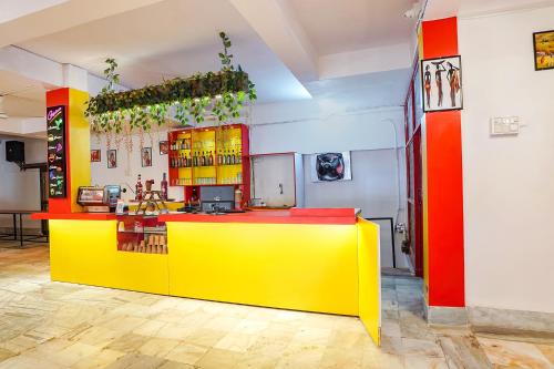 a yellow and red counter in a room at FabHotel New Shanti in Allahābād