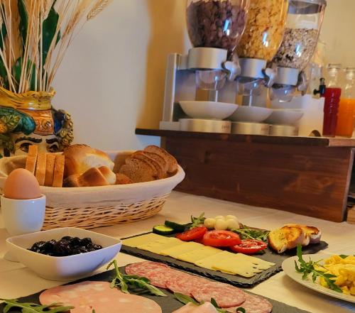 a table topped with lots of different types of food at Hotel Federico II in Castiglione di Sicilia