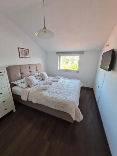 Postel nebo postele na pokoji v ubytování Apartman Franka