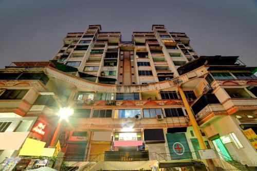 a tall building with a lot of windows at Townhouse Tulip in Vadodara
