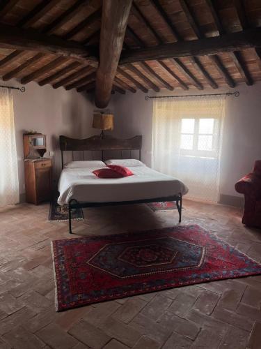 Ένα ή περισσότερα κρεβάτια σε δωμάτιο στο Hotel Relais Palazzo di Luglio