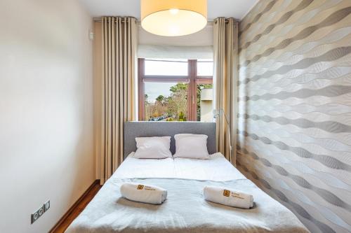 Postel nebo postele na pokoji v ubytování Liberty Premium by Baltica Apartments