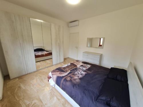 a bedroom with a large bed in a room at Appartamento La finestra sul Parco in Dalmine