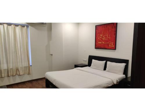 Ένα ή περισσότερα κρεβάτια σε δωμάτιο στο Aarju Luxurious Stay Calangute