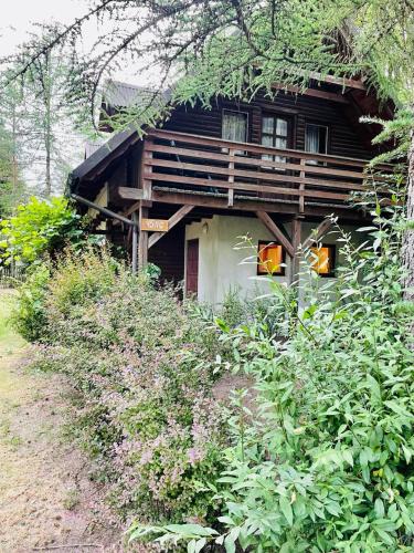 a log cabin with a grass roof at Domek letniskowy na Mazurach in Jerutki