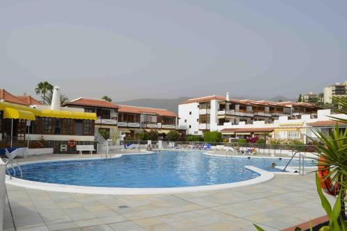 a large swimming pool in the middle of a building at Villa Tranquila, Playa del Duque in Adeje