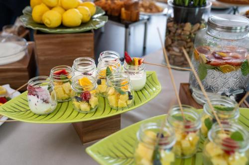 a display of desserts in jars on a table at Clipper in Pesaro